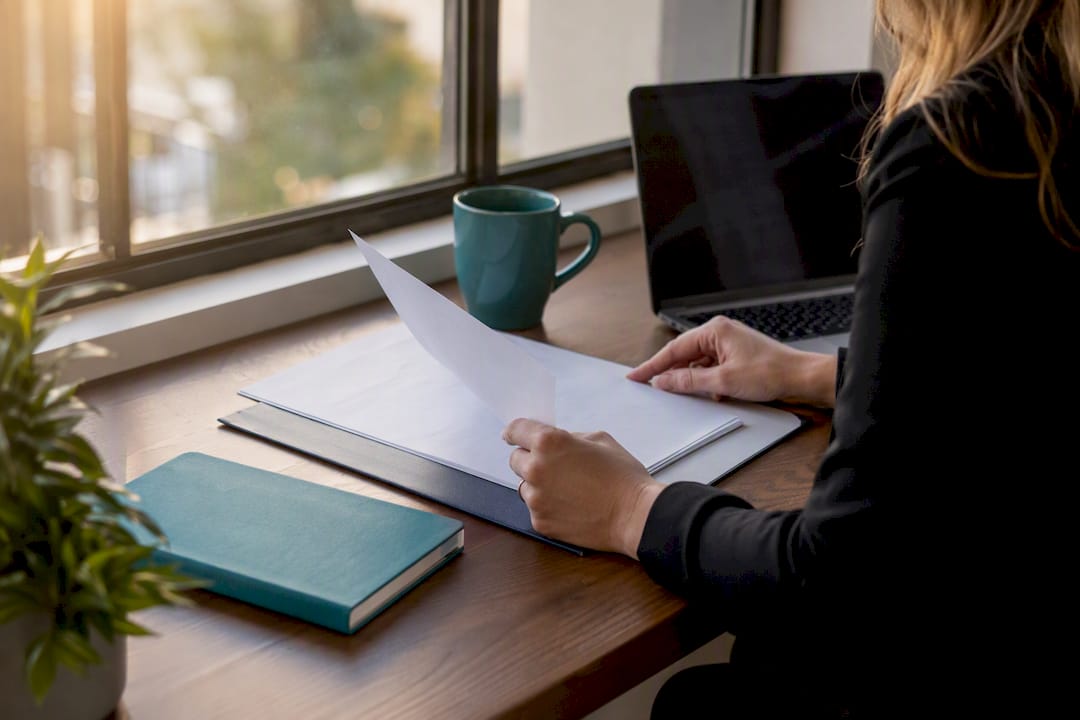 AML compliance documents on real estate desk