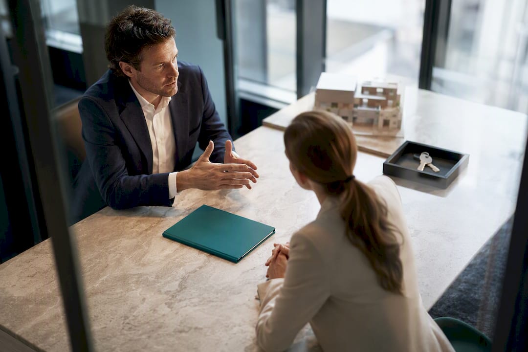 Agent and buyer reviewing due diligence