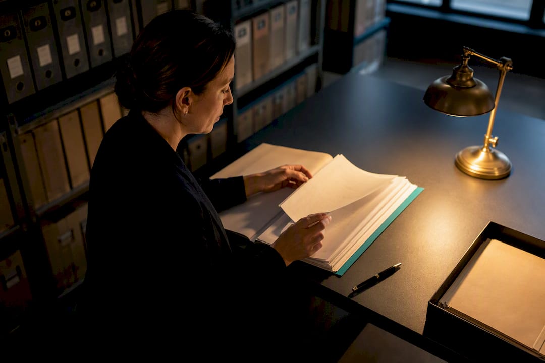Compliance officer reviewing PEP records