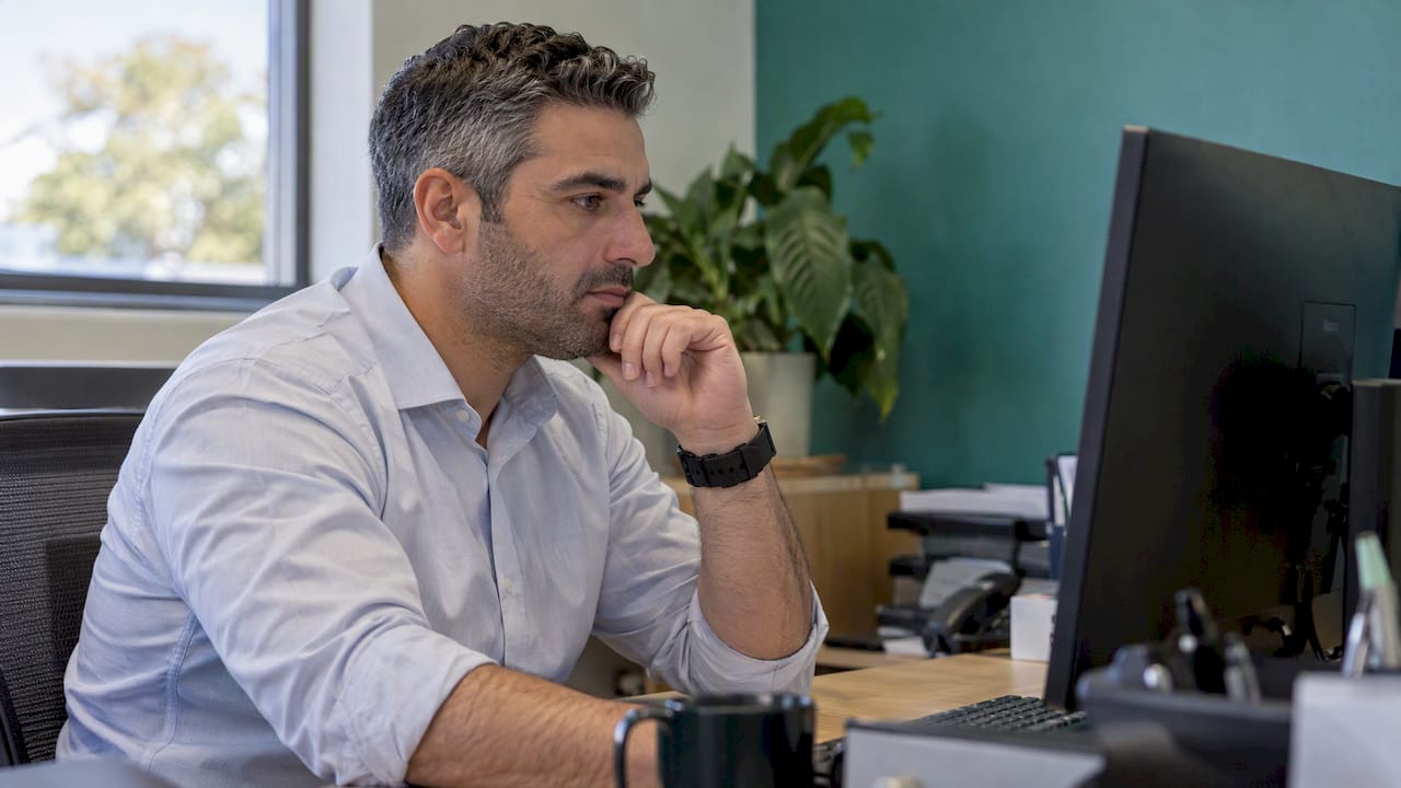 Officer reviewing an AML screening match